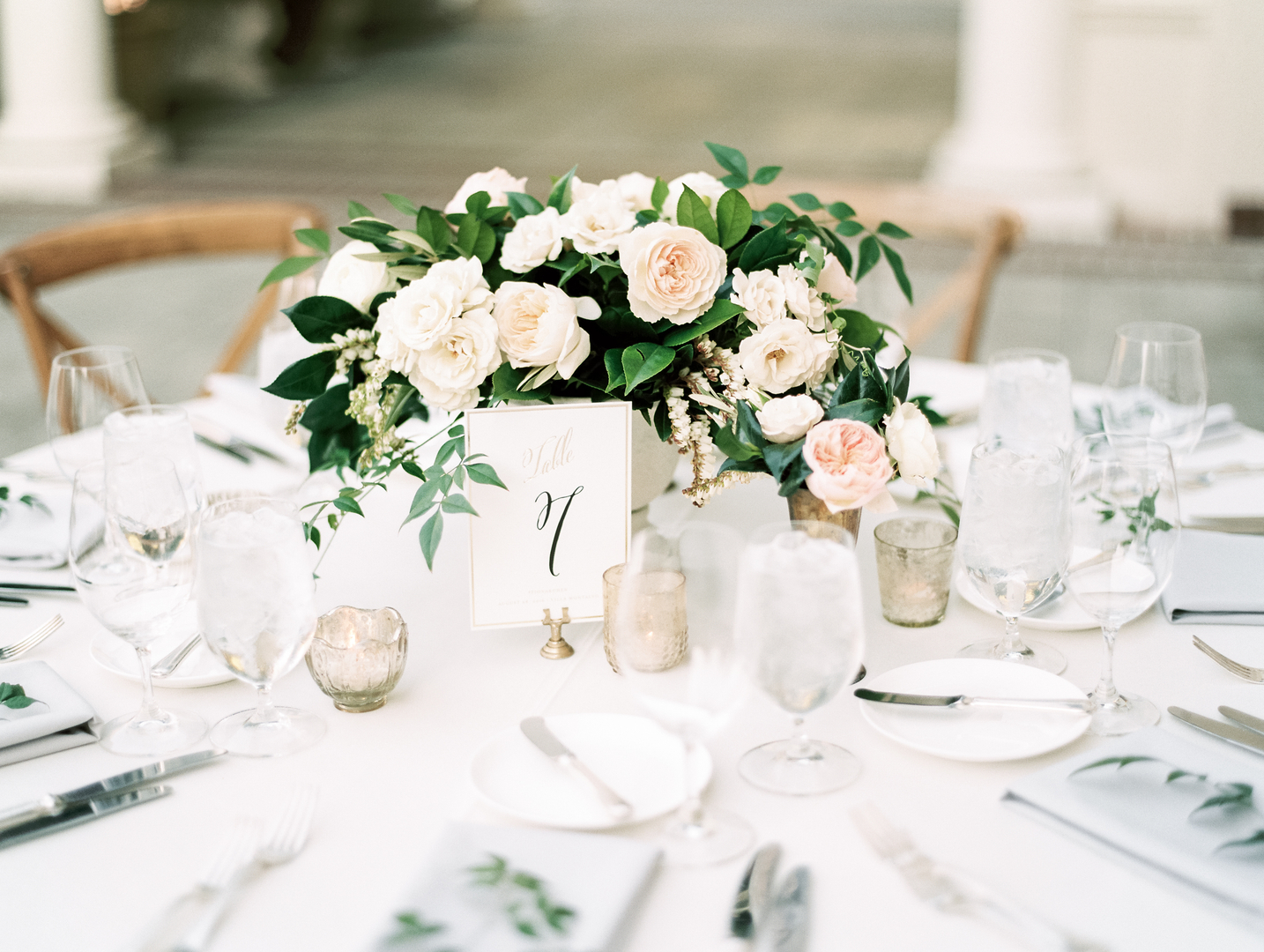 Elegant wedding centerpiece with roses and greenery